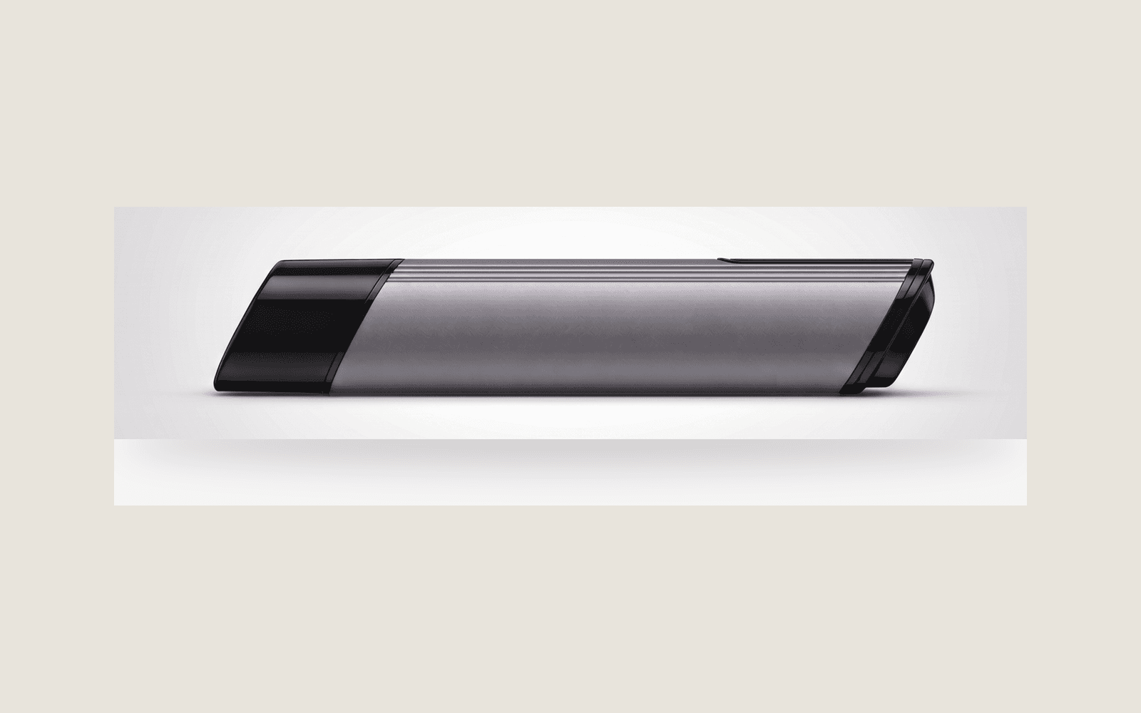 SC4P Infusion Device, silver body with gloss-black ends, on a Bone Clinical Luxury field